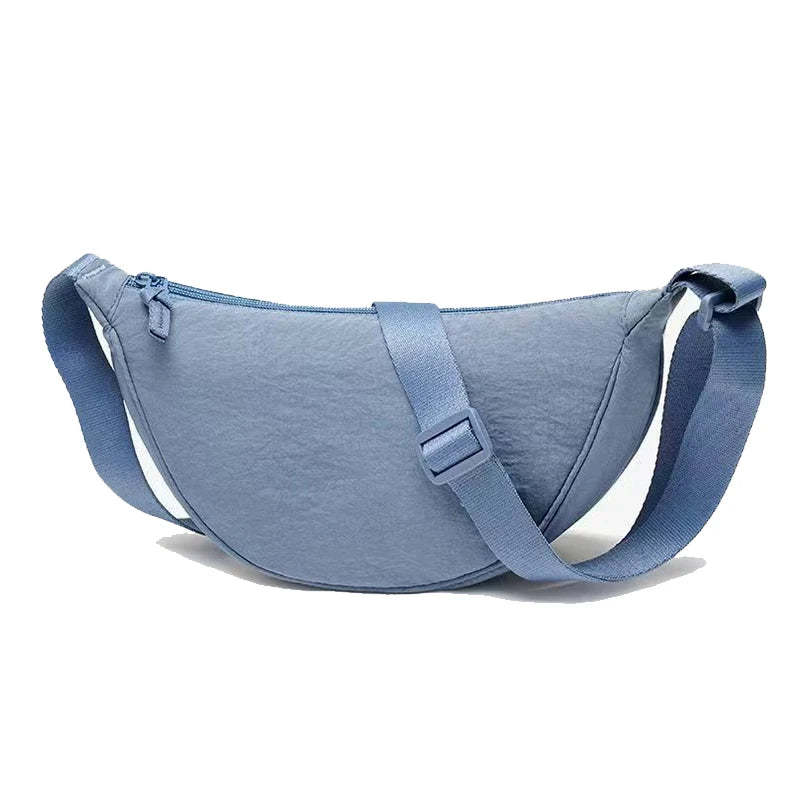 Women's bag - A round-shaped nylon bag with a cross-body strap, suitable for traveling, going to school or shopping.